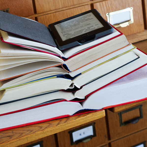 Book stack with e-reader